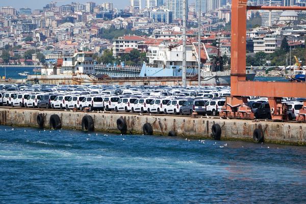 Hundreds of new vans lined up on a harbour quay