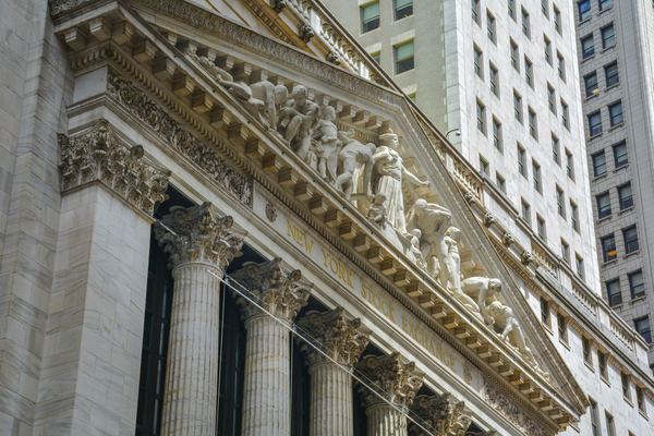 Carved stone pediment and columns of a Wall Street exchange building.