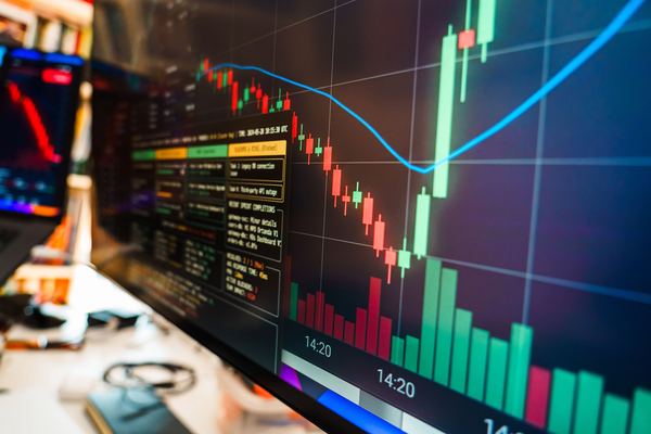 Close-up of a trading screen with a sharp drop and rebound in prices.